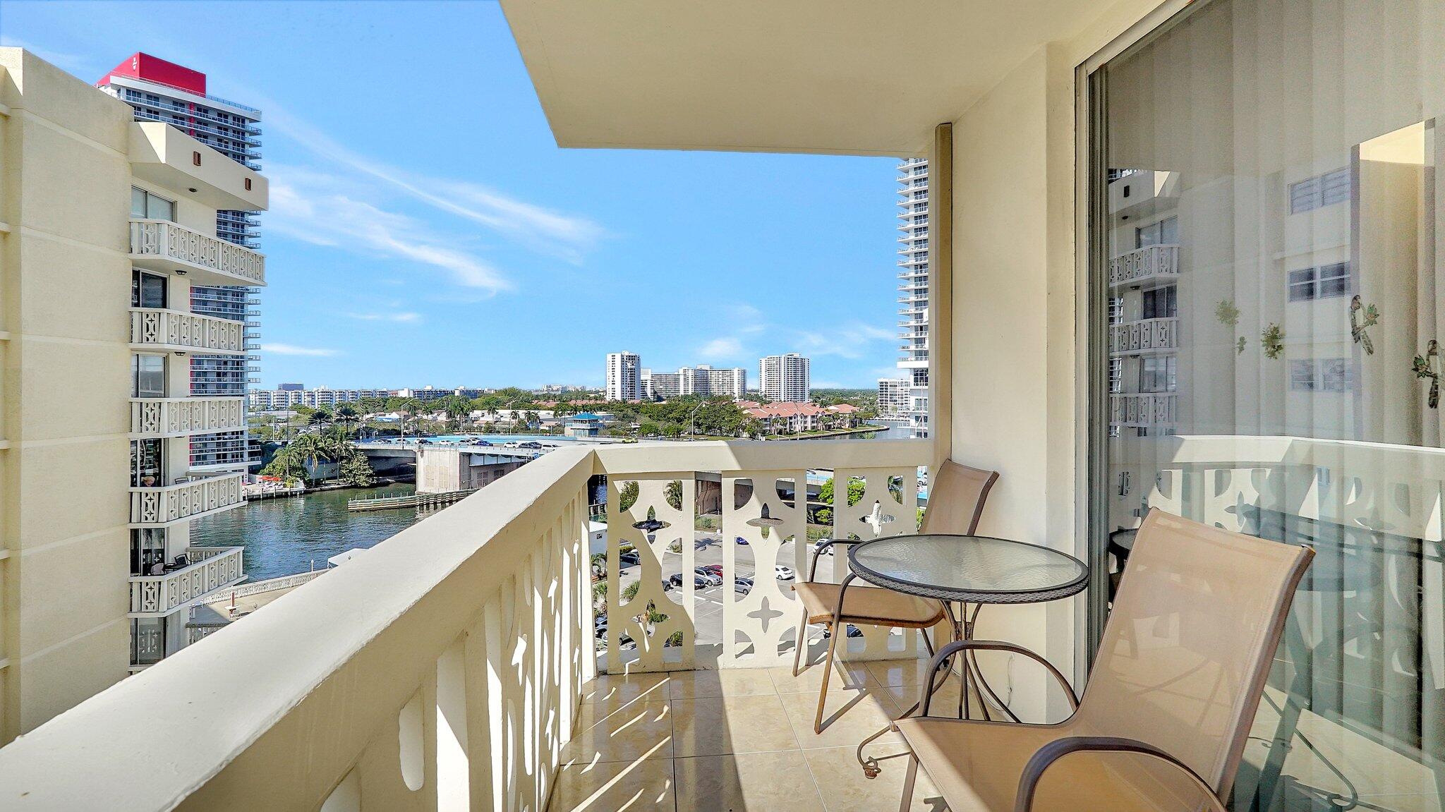 1825 South Ocean Drive, Unit 908 Hallandale Beach, FL 33009 - Photo 12 of 20 a balcony with table and chairs
