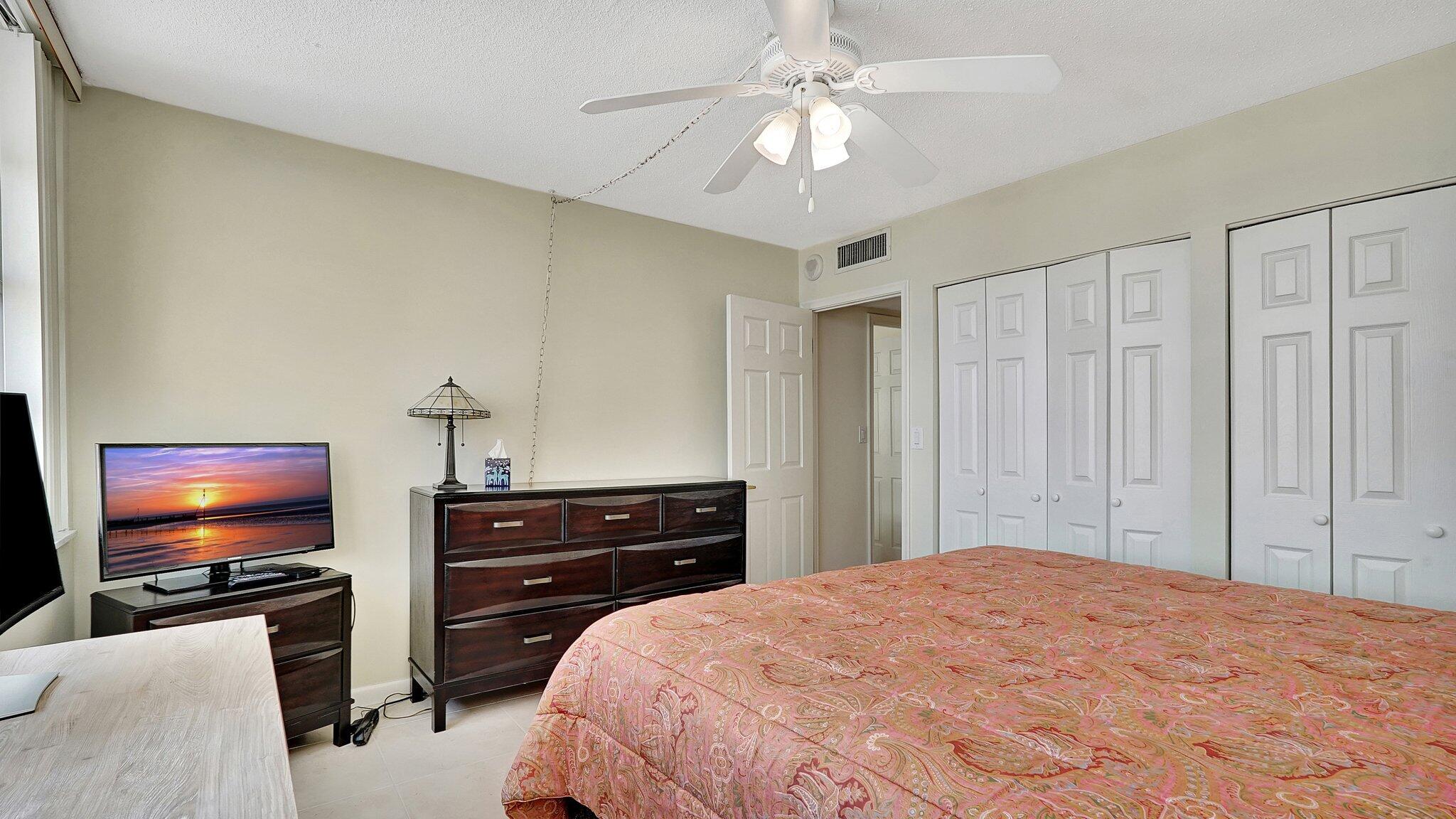 1825 South Ocean Drive, Unit 908 Hallandale Beach, FL 33009 - Photo 14 of 20 a bedroom with a bed and a flat screen tv