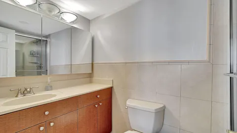 a bathroom with a sink toilet and vanity