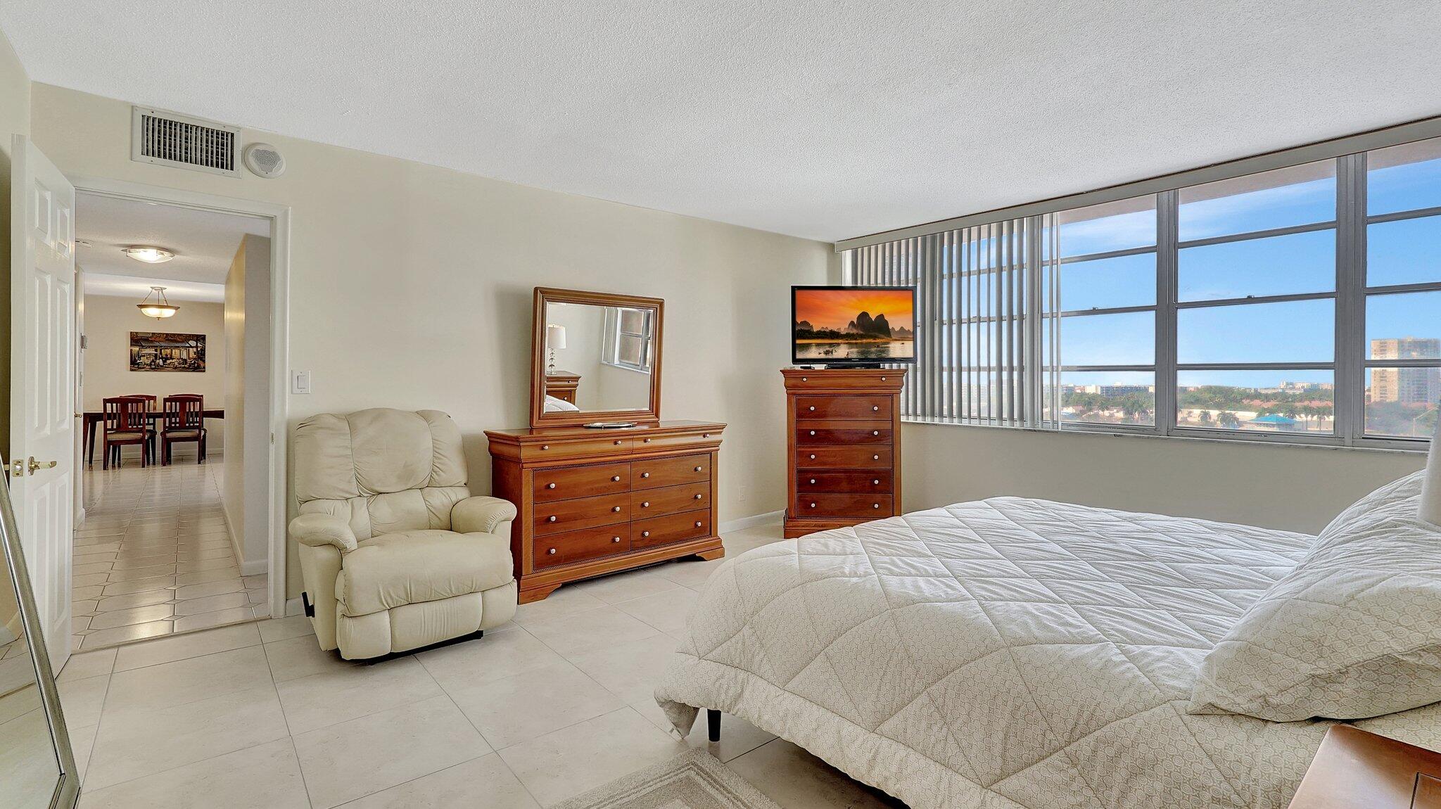 1825 South Ocean Drive, Unit 908 Hallandale Beach, FL 33009 - Photo 16 of 20 a bedroom with a bed and dresser