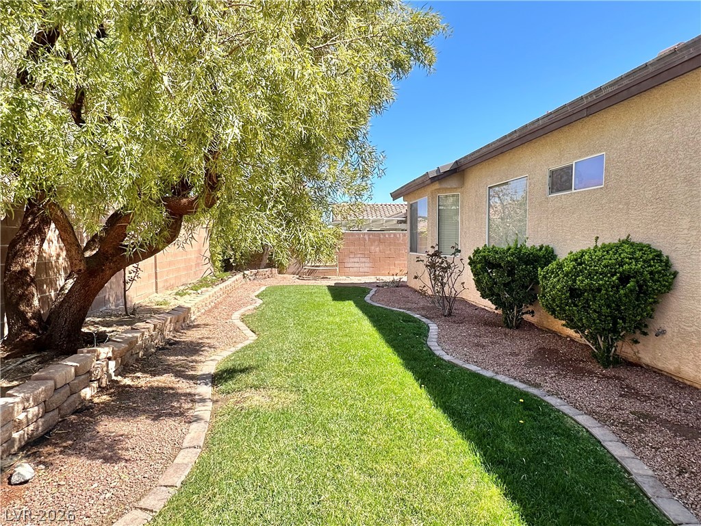 9996 Liberty View Road Las Vegas, NV 89148 - Photo 50 of 64 GRASSY BACKYARD WITH APPLE TREE.