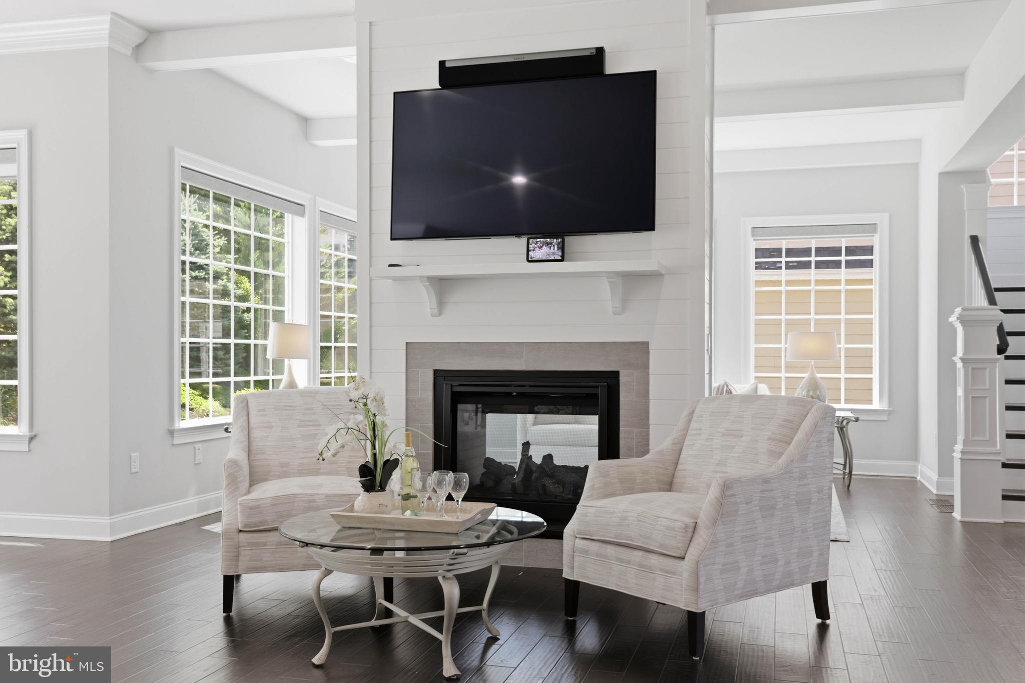 360 Addison Place Lancaster, PA 17601 - Photo 3 of 78 a living room with furniture a flat screen tv and a fireplace