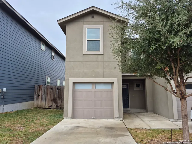 a front view of a house with a garage