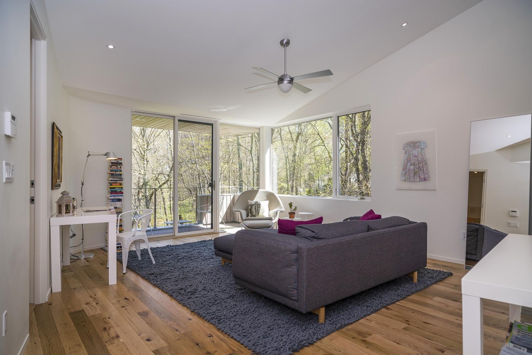 364 Hollow Tree Ridge Road Darien, CT 06820 - Photo 19 of 31 a living room with furniture and a large window
