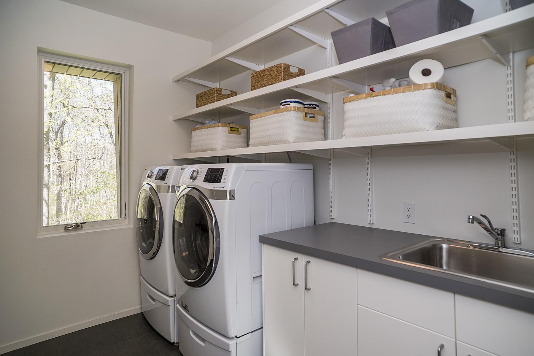 364 Hollow Tree Ridge Road Darien, CT 06820 - Photo 24 of 31 a utility room with dryer and washer