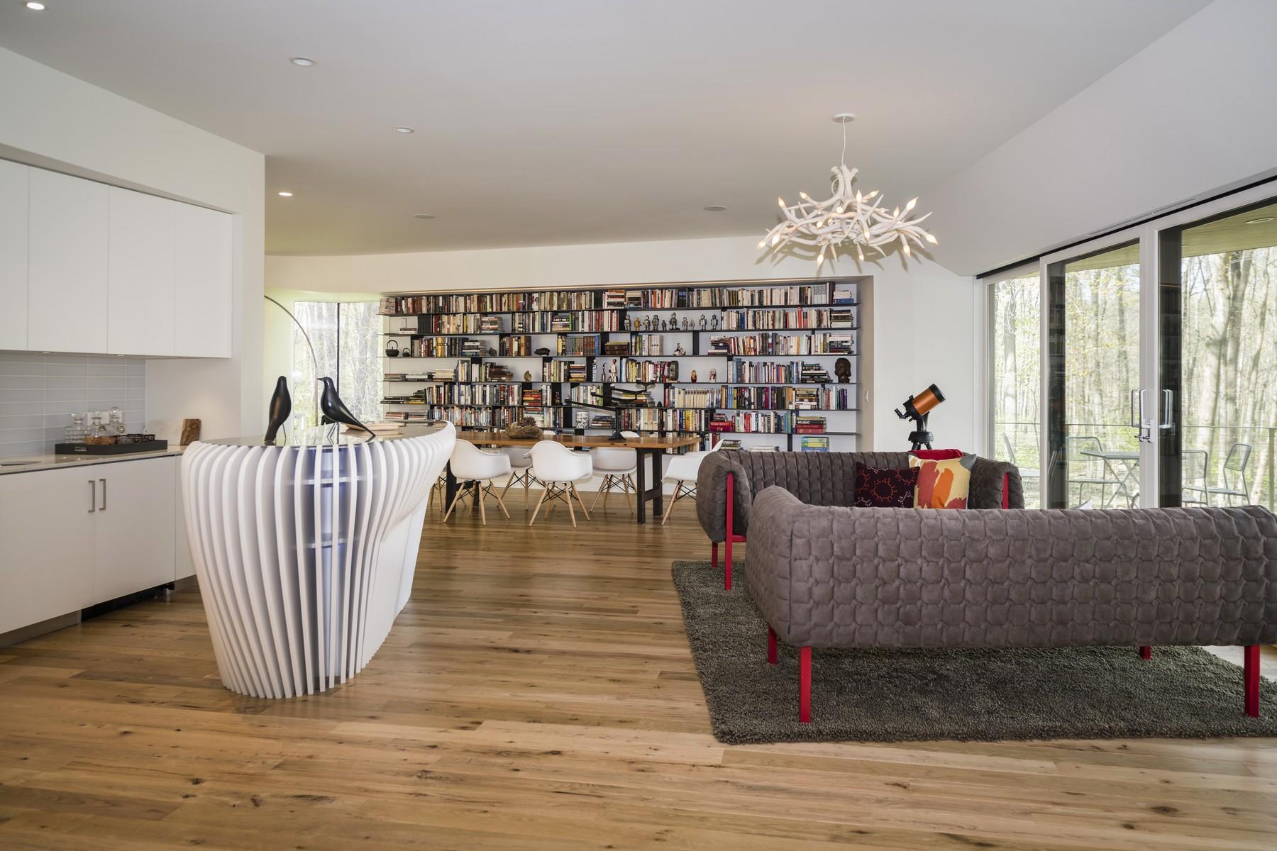 364 Hollow Tree Ridge Road Darien, CT 06820 - Photo 8 of 31 a living room with furniture wooden floor and floor to ceiling windows