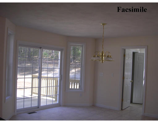43 B Ledge Road Pelham, NH 03076 - Photo 3 of 6 a view of an empty room with a window