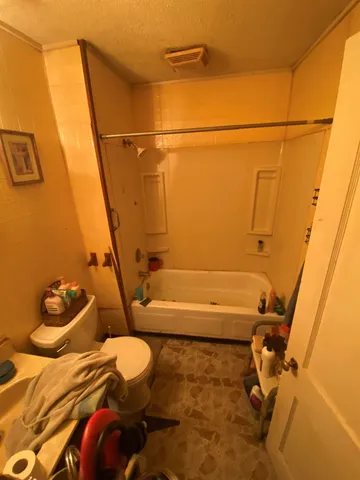 a bathroom with a sink and toilet