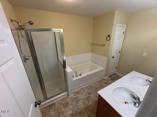 1311 Canyon Rock Court, Unit 105 Raleigh, NC 27610 - Photo 11 of 11 a bathroom with a tub sink and mirror