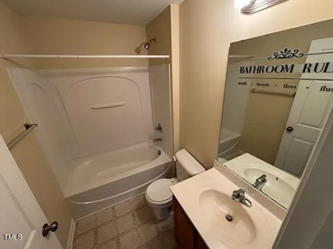 a bathroom with a sink a toilet and bathtub
