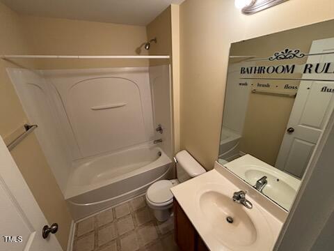 1311 Canyon Rock Court, Unit 105 Raleigh, NC 27610 - Photo 6 of 11 a bathroom with a sink a toilet and bathtub
