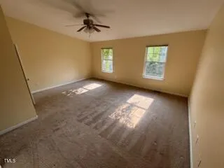 a view of empty room with windows