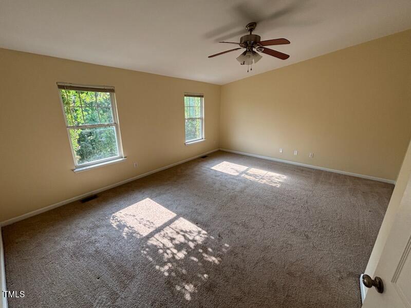 1311 Canyon Rock Court, Unit 105 Raleigh, NC 27610 - Photo 10 of 11 a view of an empty room with a window