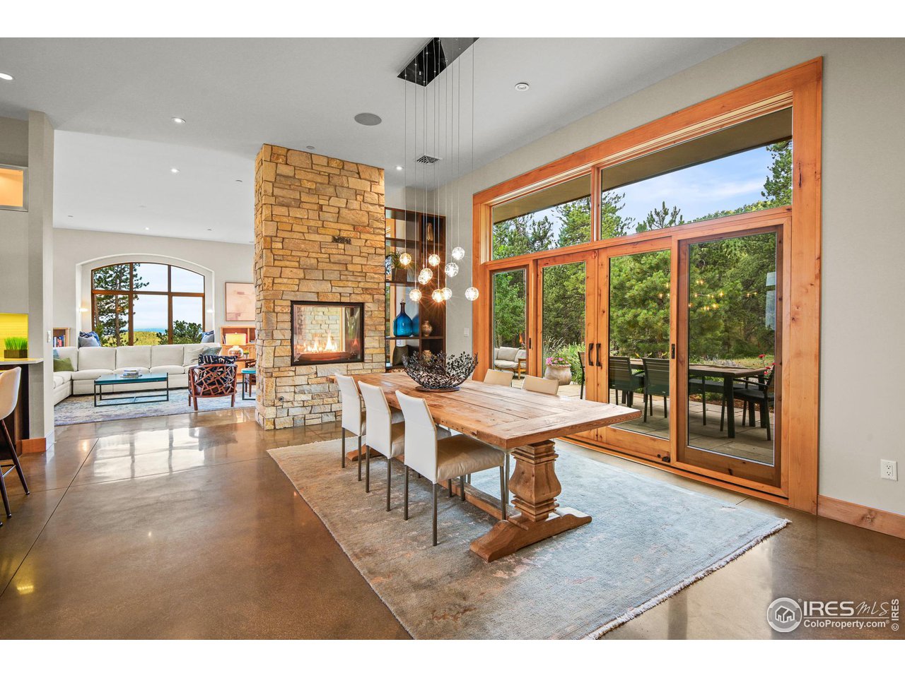 575 Reed Ranch Road Boulder, CO 80302 - Photo 11 of 40 a living room with fireplace furniture and a large window