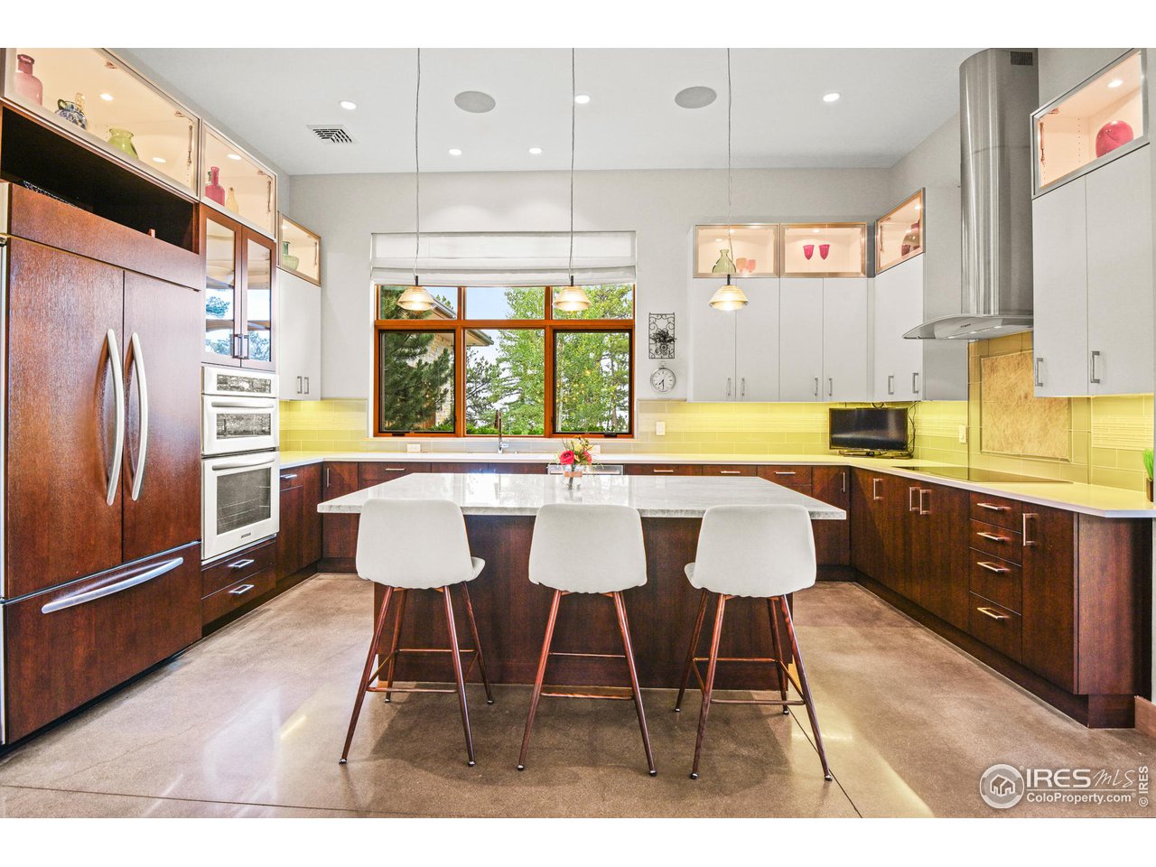 575 Reed Ranch Road Boulder, CO 80302 - Photo 13 of 40 a view of a dining room with furniture a chandelier and wooden floor