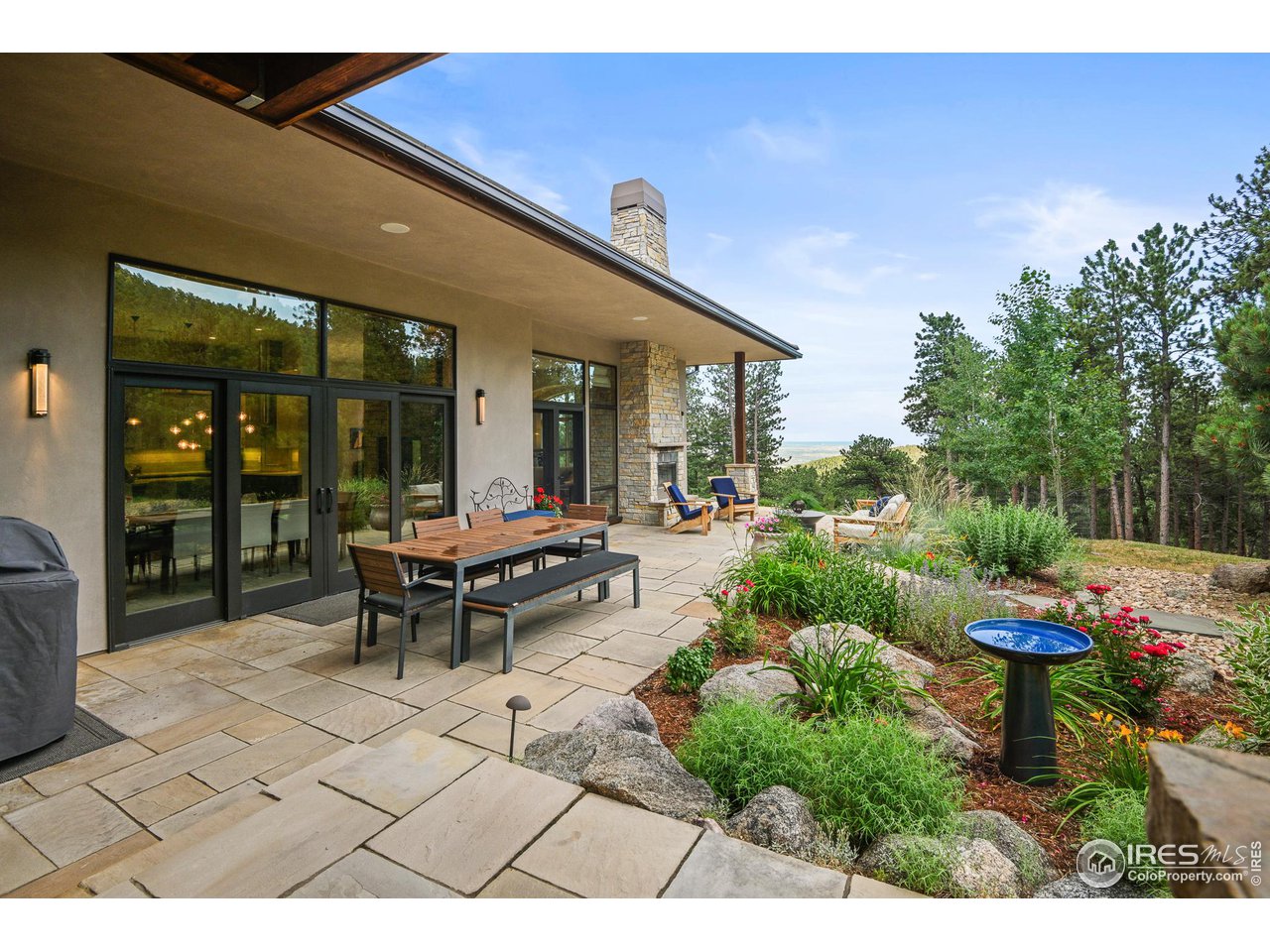 575 Reed Ranch Road Boulder, CO 80302 - Photo 17 of 40 a view of a patio with table and chairs and potted plants