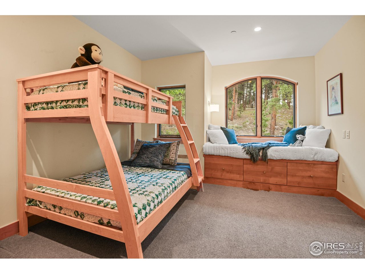 575 Reed Ranch Road Boulder, CO 80302 - Photo 21 of 40 a living room with furniture and a flat screen tv