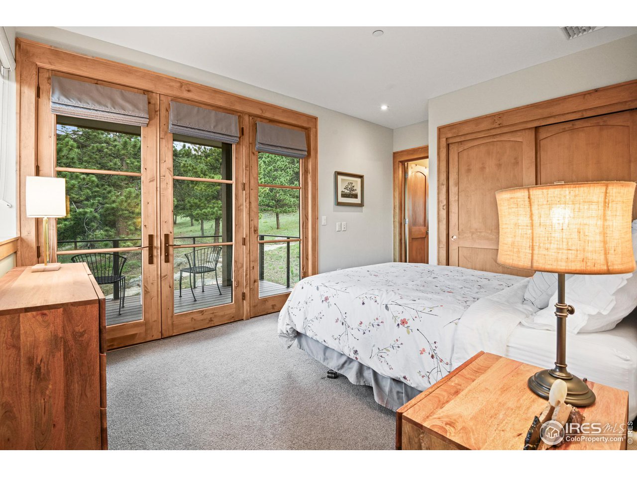 575 Reed Ranch Road Boulder, CO 80302 - Photo 22 of 40 a bedroom with a bed and large window