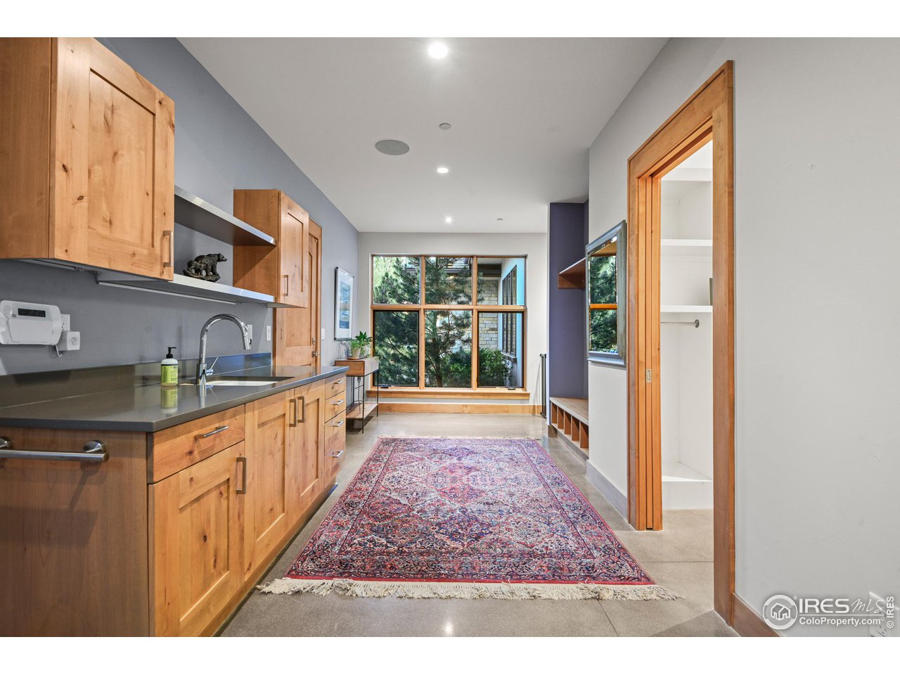 575 Reed Ranch Road Boulder, CO 80302 - Photo 27 of 40 a open kitchen with kitchen island granite countertop a large window
