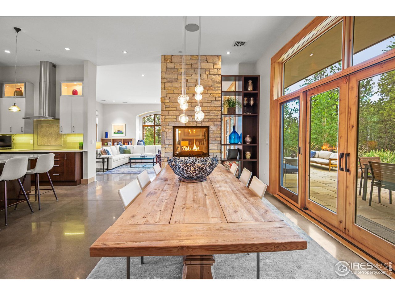 575 Reed Ranch Road Boulder, CO 80302 - Photo 5 of 40 a living room with furniture a wooden floor and next to a window