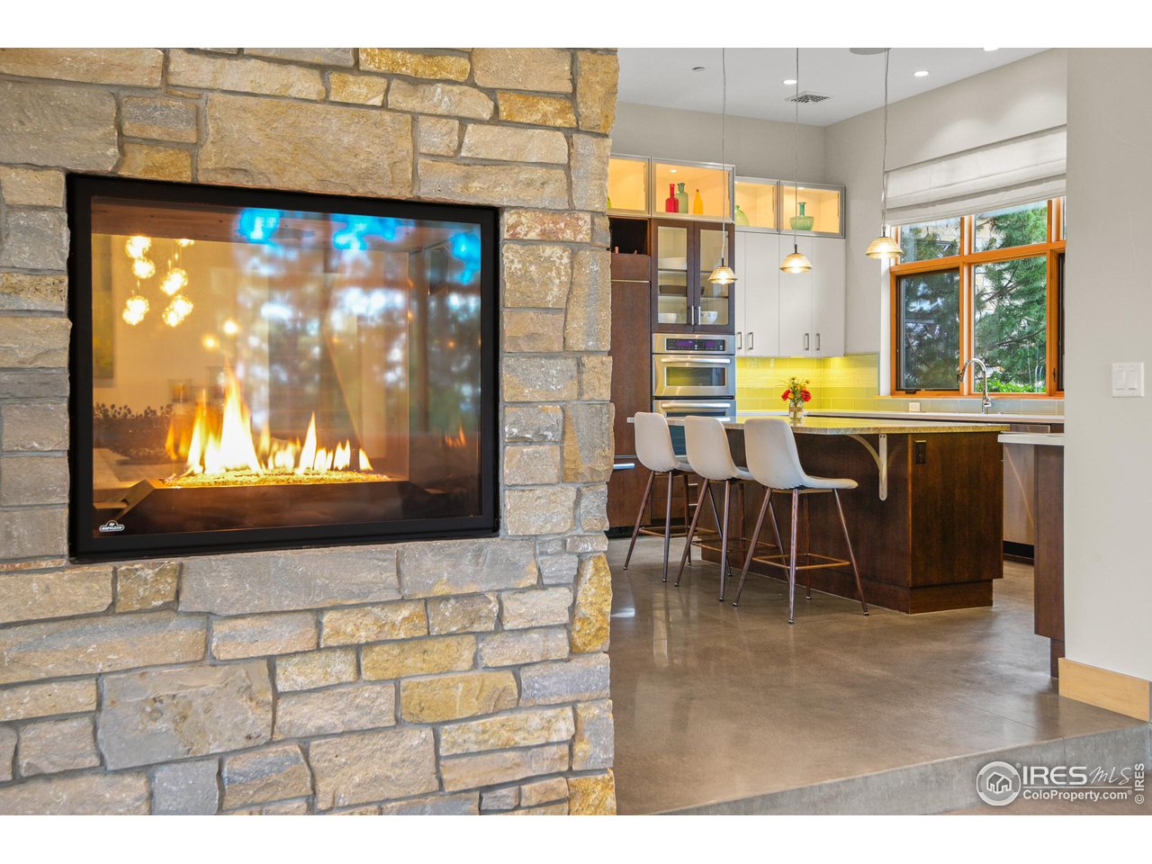 575 Reed Ranch Road Boulder, CO 80302 - Photo 6 of 40 a living room with a flat screen tv and outdoor view