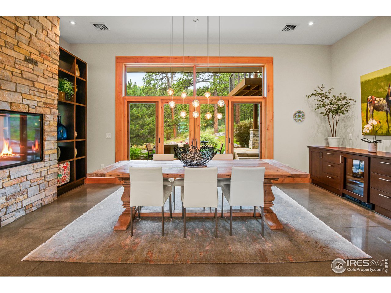 575 Reed Ranch Road Boulder, CO 80302 - Photo 7 of 40 a living room with furniture and a flat screen tv