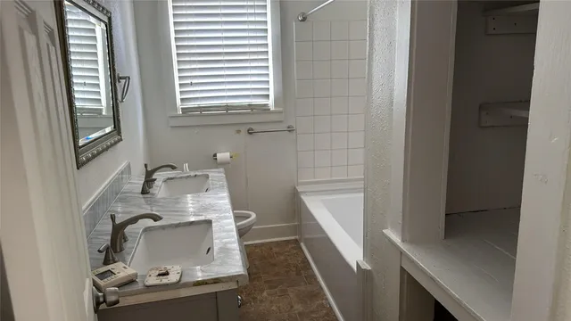 a bathroom with a sink and mirror
