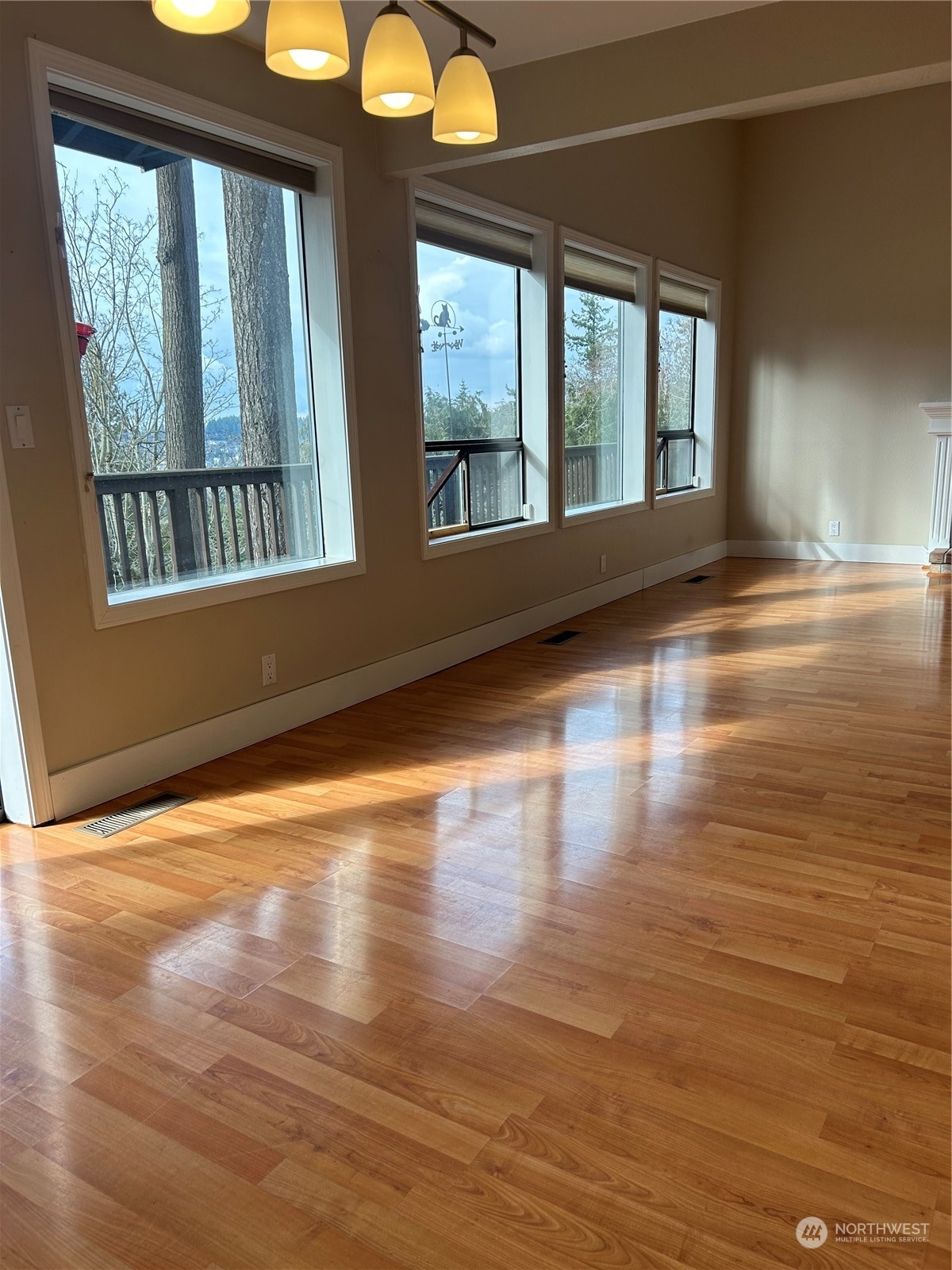 2106 37th Street Bellingham, WA 98229 - Photo 11 of 32 a view of an empty room with wooden floor and a window