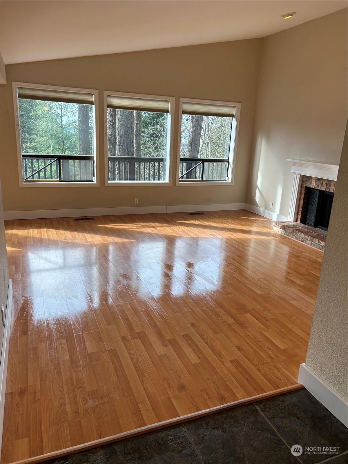 2106 37th Street Bellingham, WA 98229 - Photo 15 of 32 an empty room with wooden floor and windows