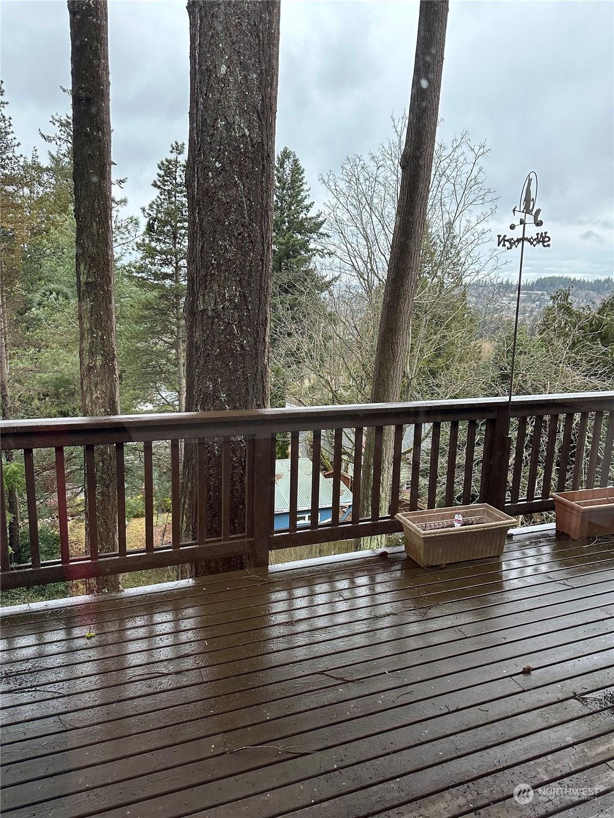 2106 37th Street Bellingham, WA 98229 - Photo 16 of 32 a view of a balcony with wooden floor next to a yard
