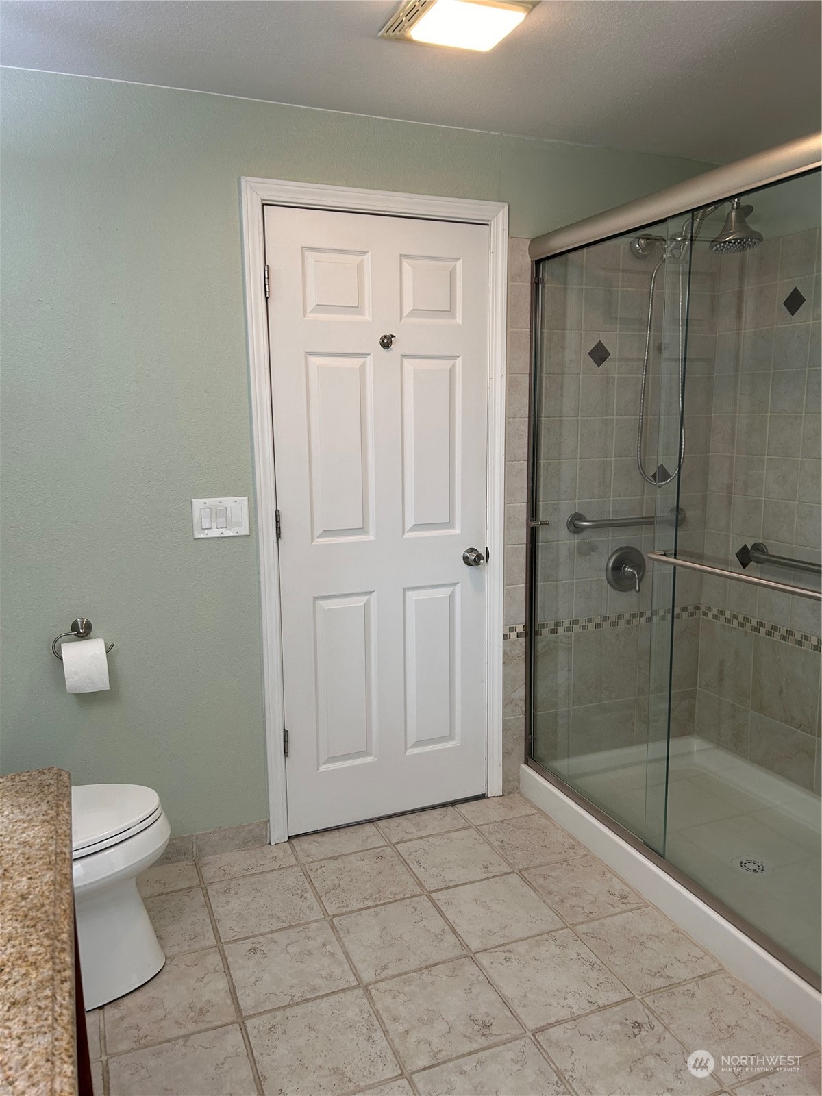 2106 37th Street Bellingham, WA 98229 - Photo 19 of 32 a bathroom with a shower a toilet and a sink