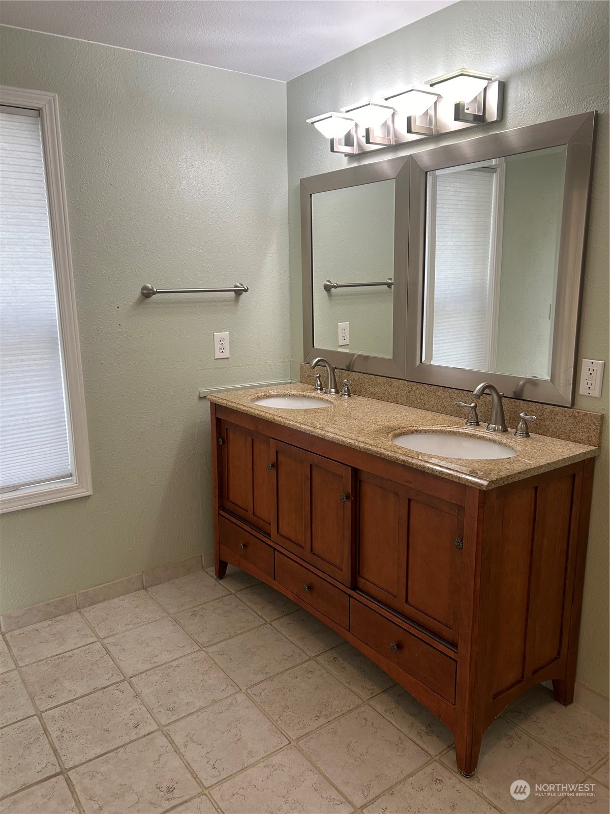 2106 37th Street Bellingham, WA 98229 - Photo 20 of 32 a bathroom with a sink and a mirror
