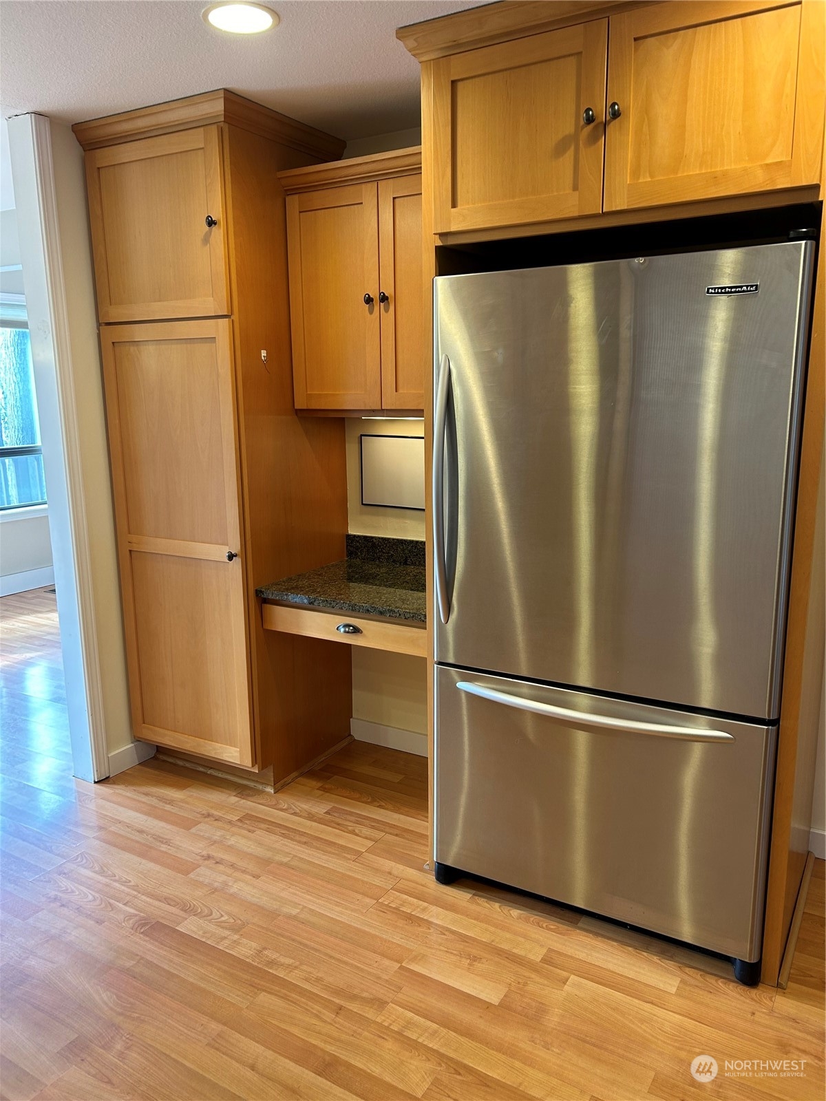 2106 37th Street Bellingham, WA 98229 - Photo 8 of 32 a metallic refrigerator freezer sitting in a kitchen