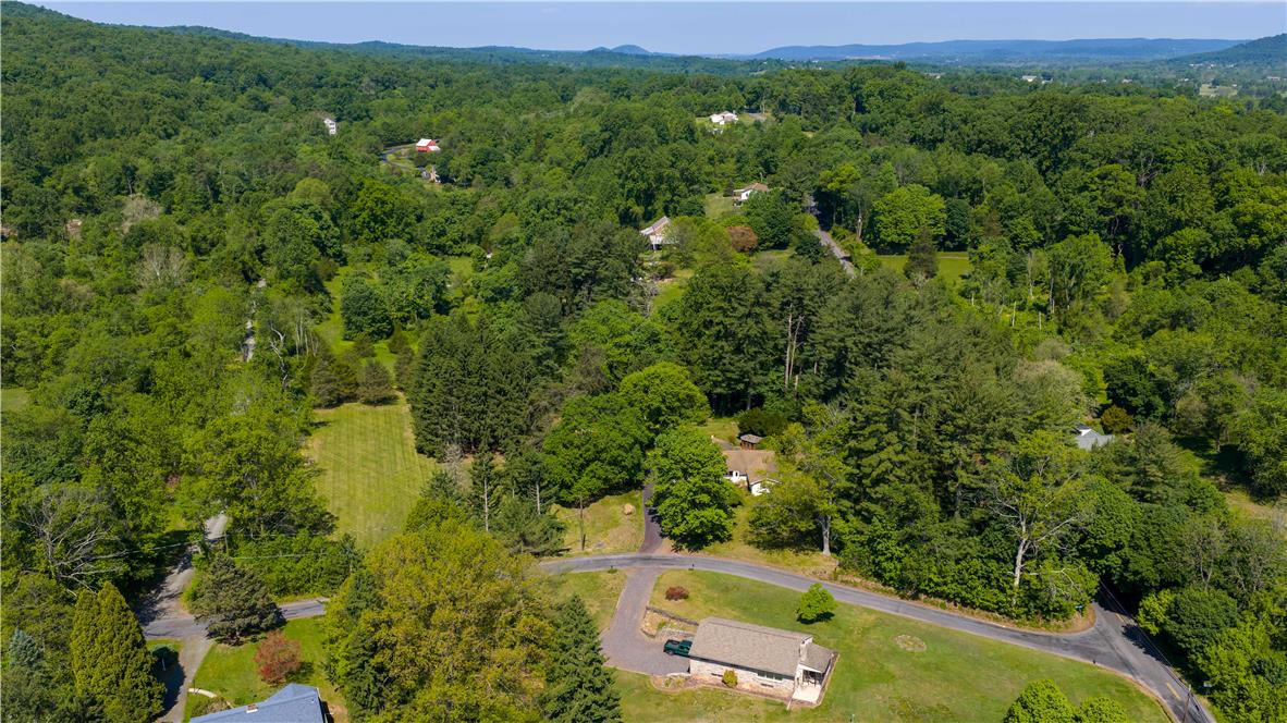 Coldsprings Rd Union Pottstown, PA 19465 - Photo 18 of 71 Discover a tranquil, private wooded estate with a charming home nestled among lush trees and verdant landscapes.
