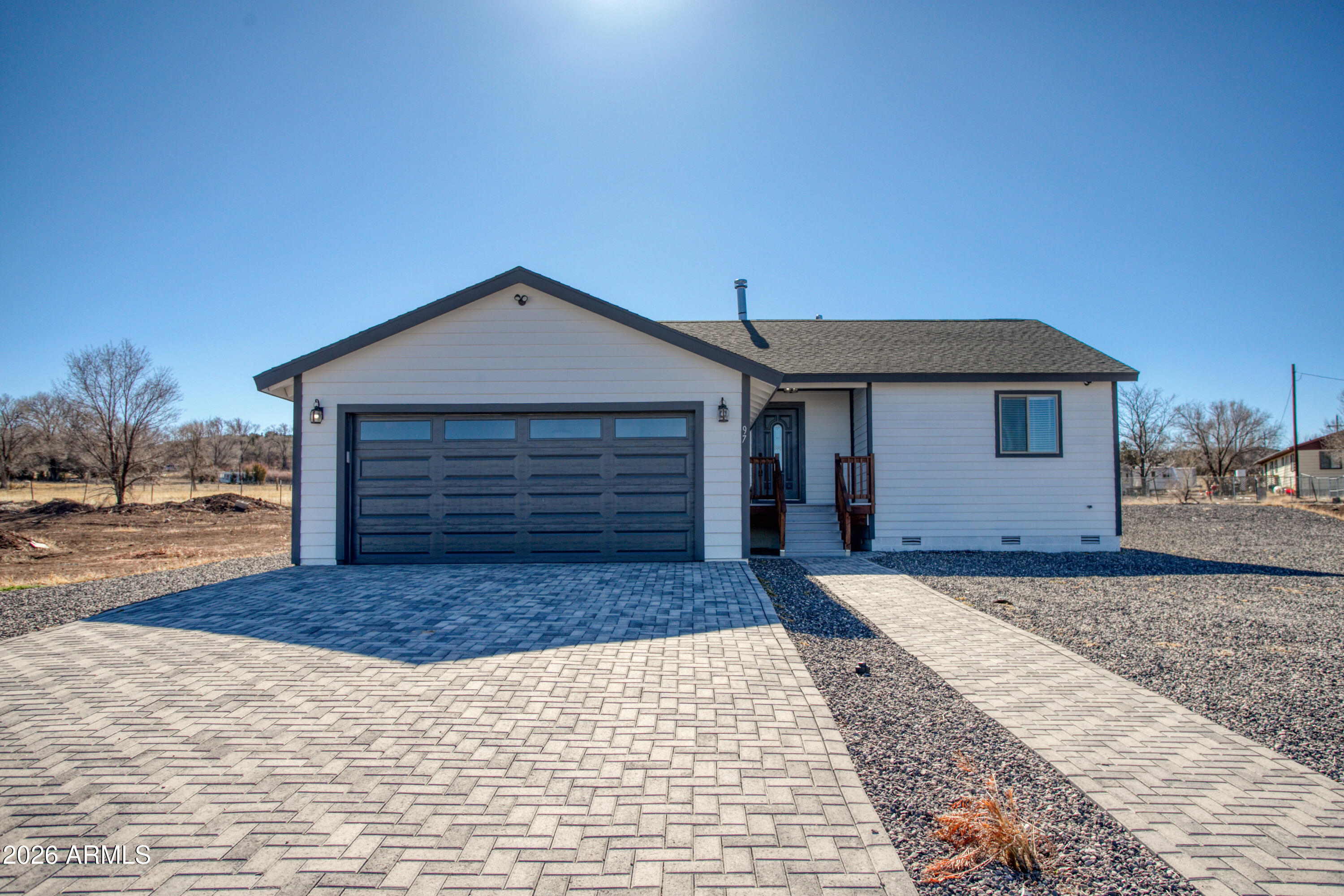 97 Mulligan Road Eagar, AZ 85925 - Photo 2 of 27 a front view of a house with a yard