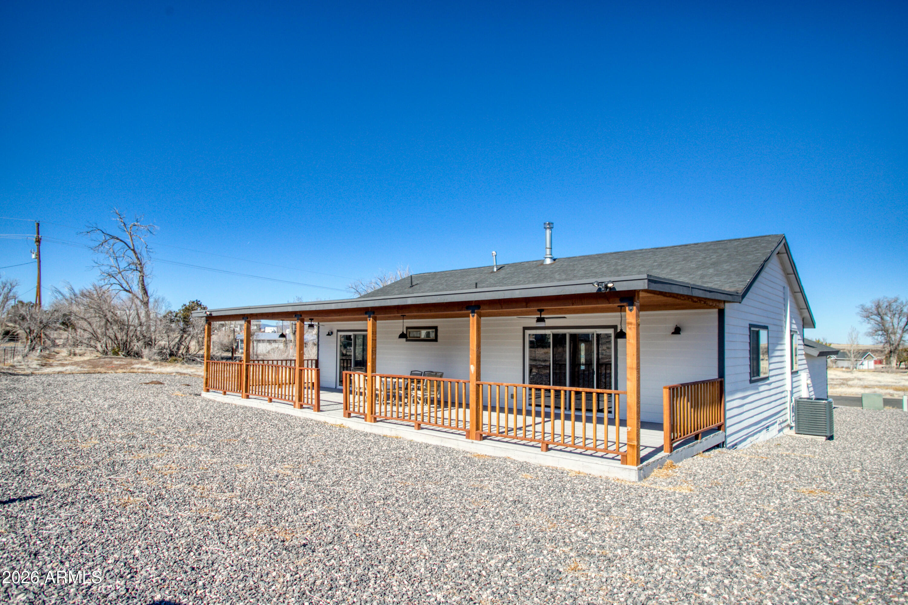 97 Mulligan Road Eagar, AZ 85925 - Photo 24 of 27 a view of house with a big yard