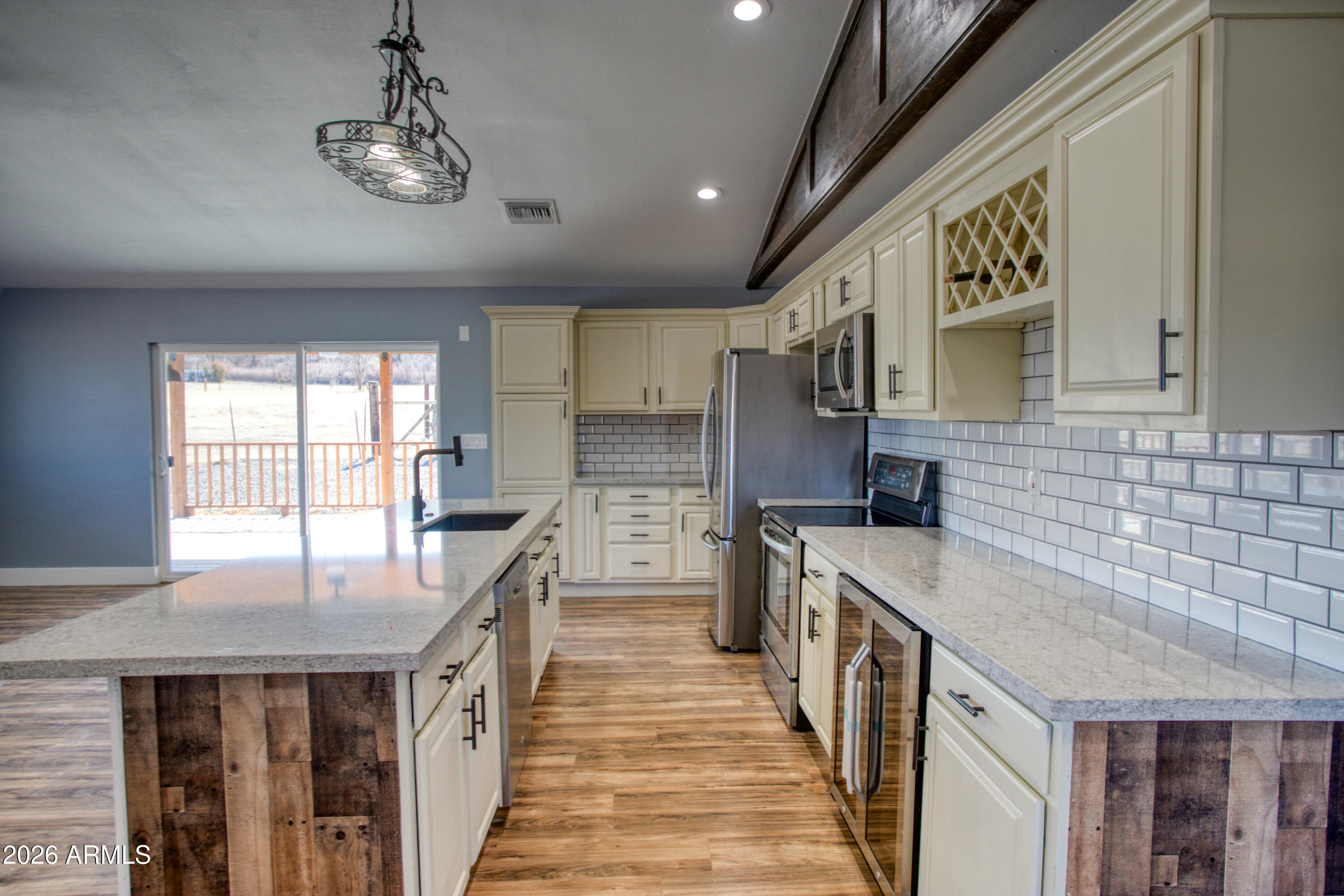 97 Mulligan Road Eagar, AZ 85925 - Photo 5 of 27 a kitchen with a stove and a sink