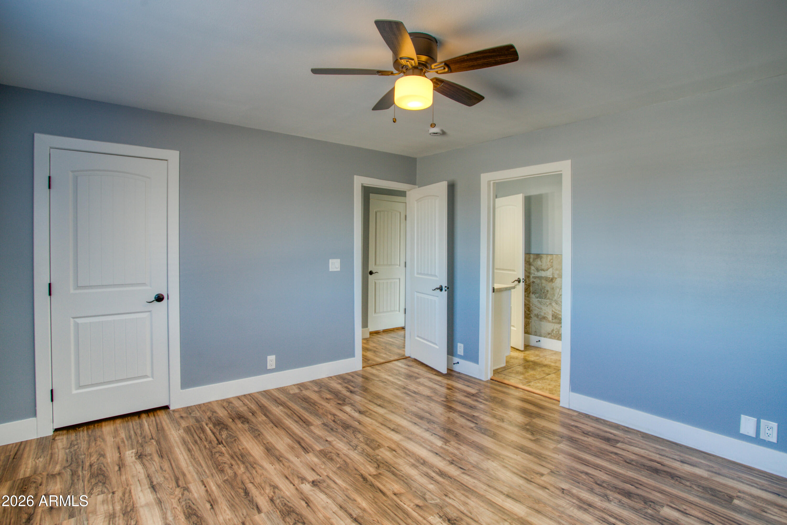 97 Mulligan Road Eagar, AZ 85925 - Photo 9 of 27 a view of empty room with wooden floor and fan