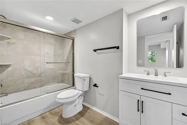 a bathroom with a toilet a sink and a bathtub