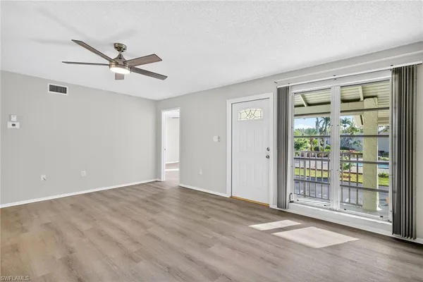 a view of an empty room with a window