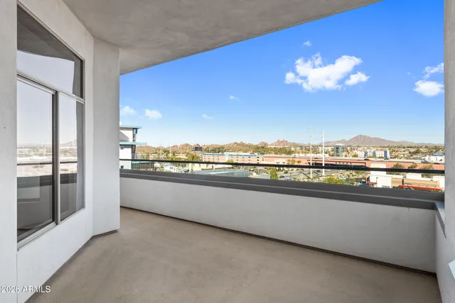 a view of a living room with a large window