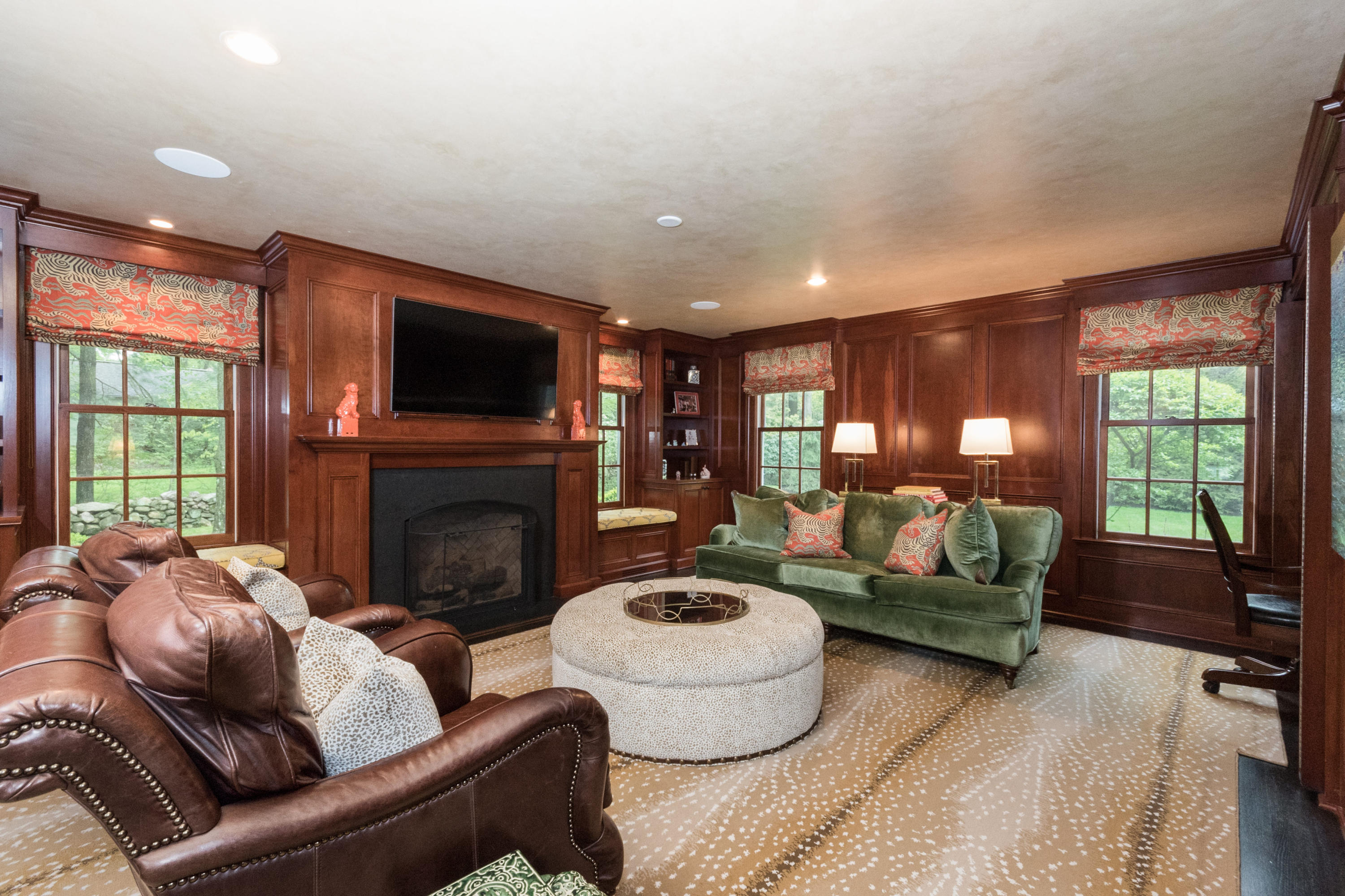 280 Hollow Tree Ridge Road Darien, CT 06820 - Photo 13 of 66 a living room with furniture a fireplace and a flat screen tv