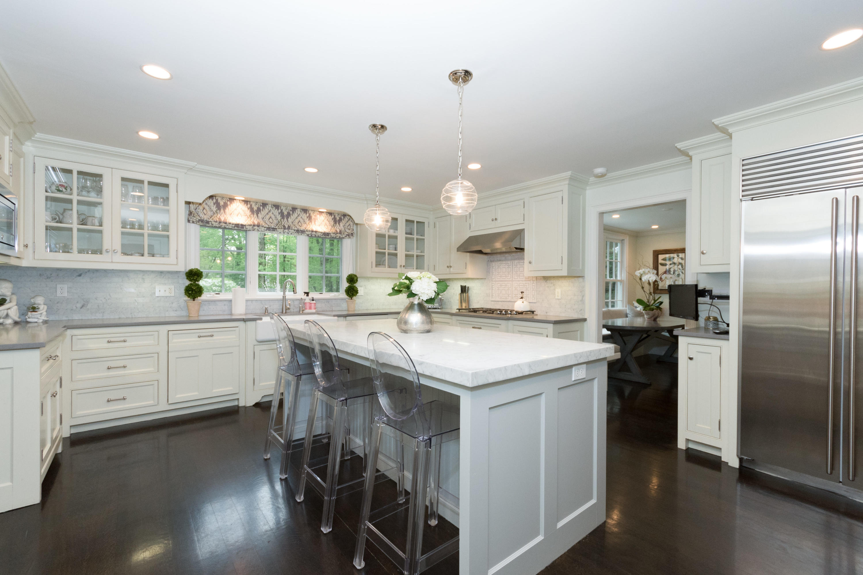 280 Hollow Tree Ridge Road Darien, CT 06820 - Photo 16 of 66 a kitchen with kitchen island a sink stove and refrigerator
