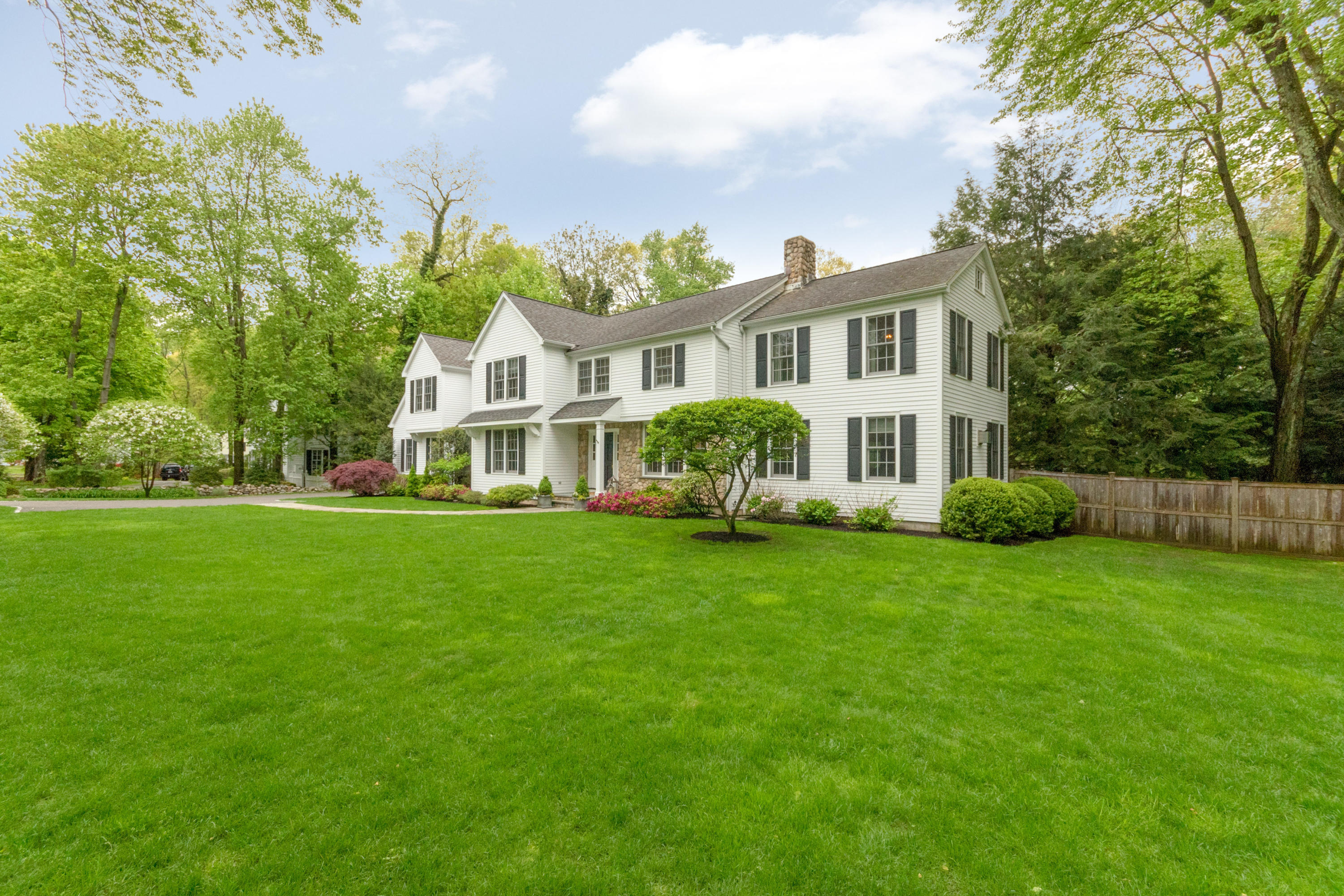 280 Hollow Tree Ridge Road Darien, CT 06820 - Photo 2 of 66 a front view of a house with a garden