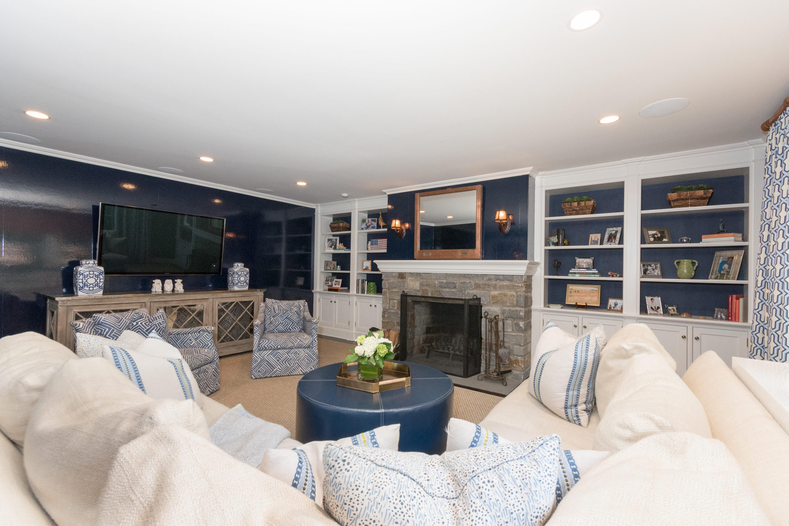 280 Hollow Tree Ridge Road Darien, CT 06820 - Photo 25 of 66 a living room with furniture and a fireplace