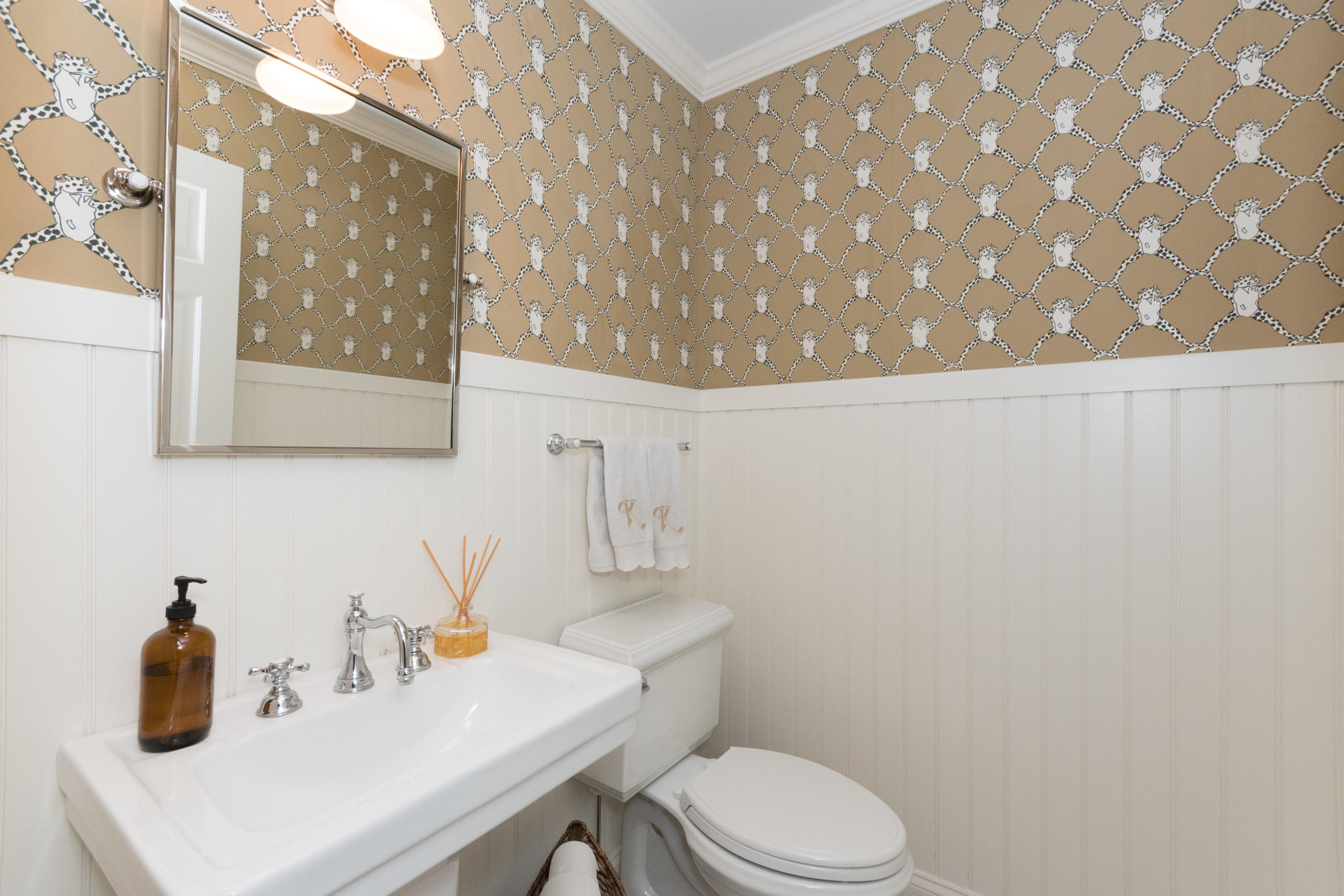 280 Hollow Tree Ridge Road Darien, CT 06820 - Photo 29 of 66 a bathroom with a sink a toilet and mirror