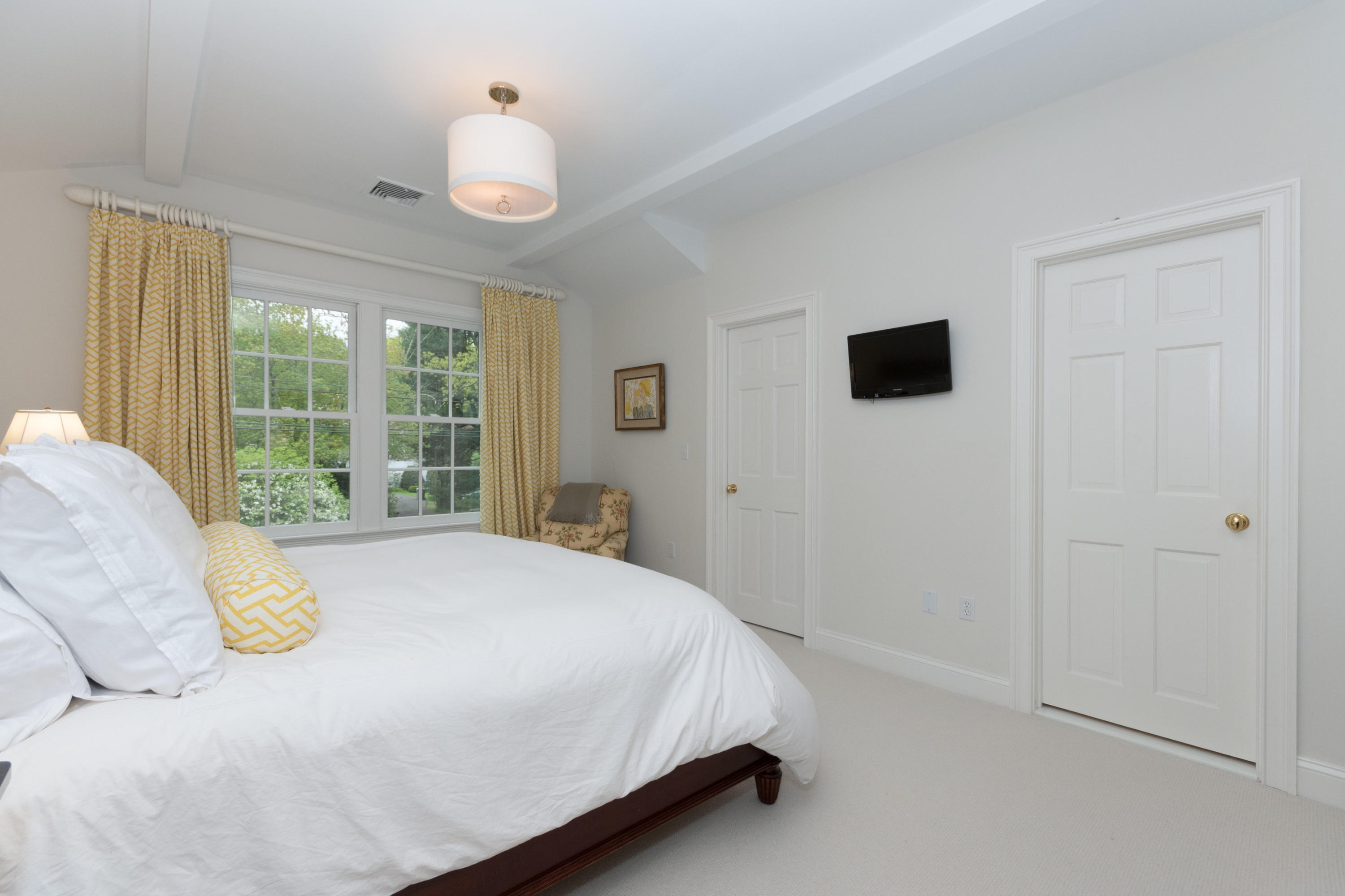 280 Hollow Tree Ridge Road Darien, CT 06820 - Photo 43 of 66 a bedroom with a bed and a window