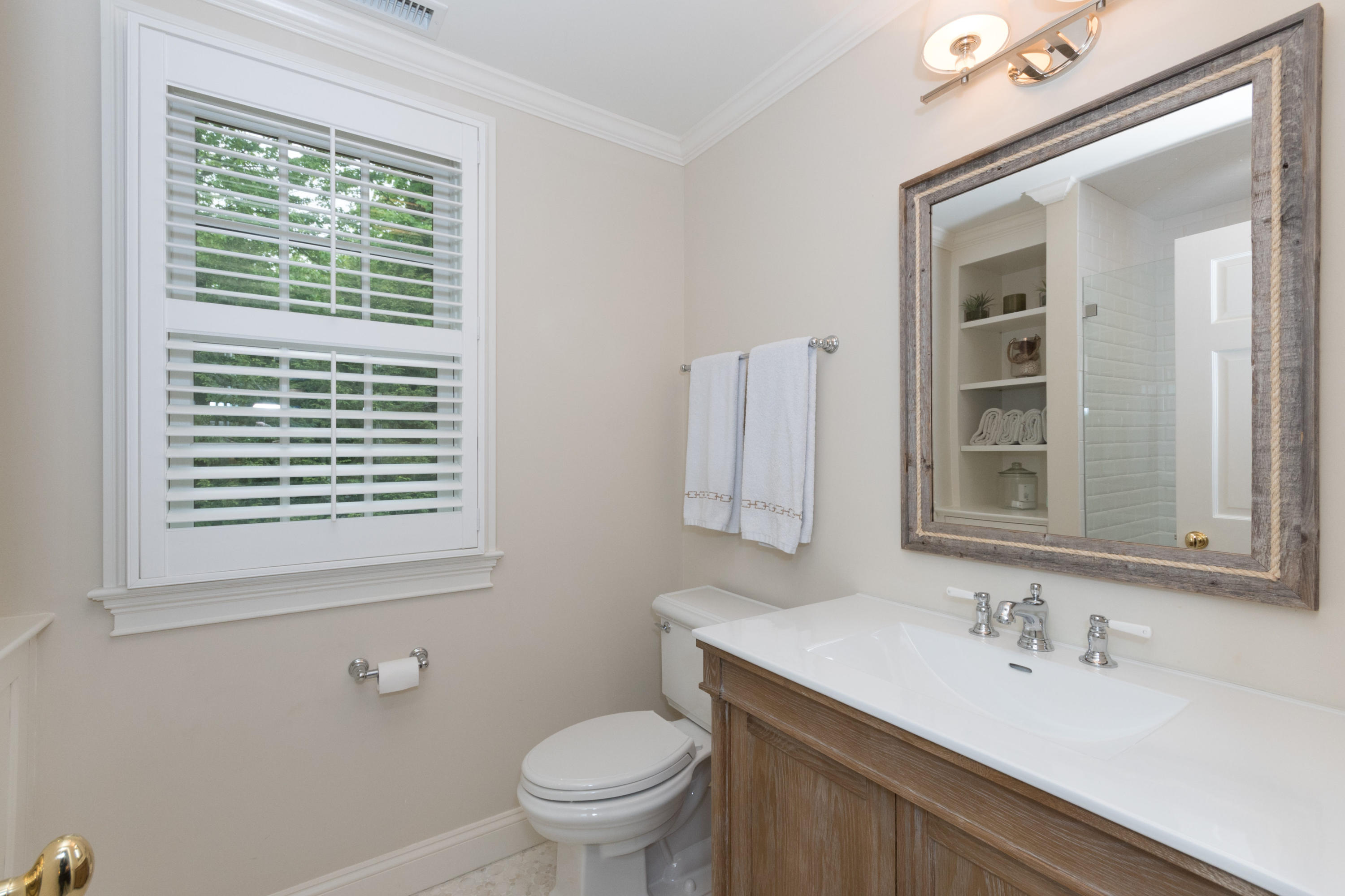 280 Hollow Tree Ridge Road Darien, CT 06820 - Photo 45 of 66 a bathroom with a sink a toilet and a mirror