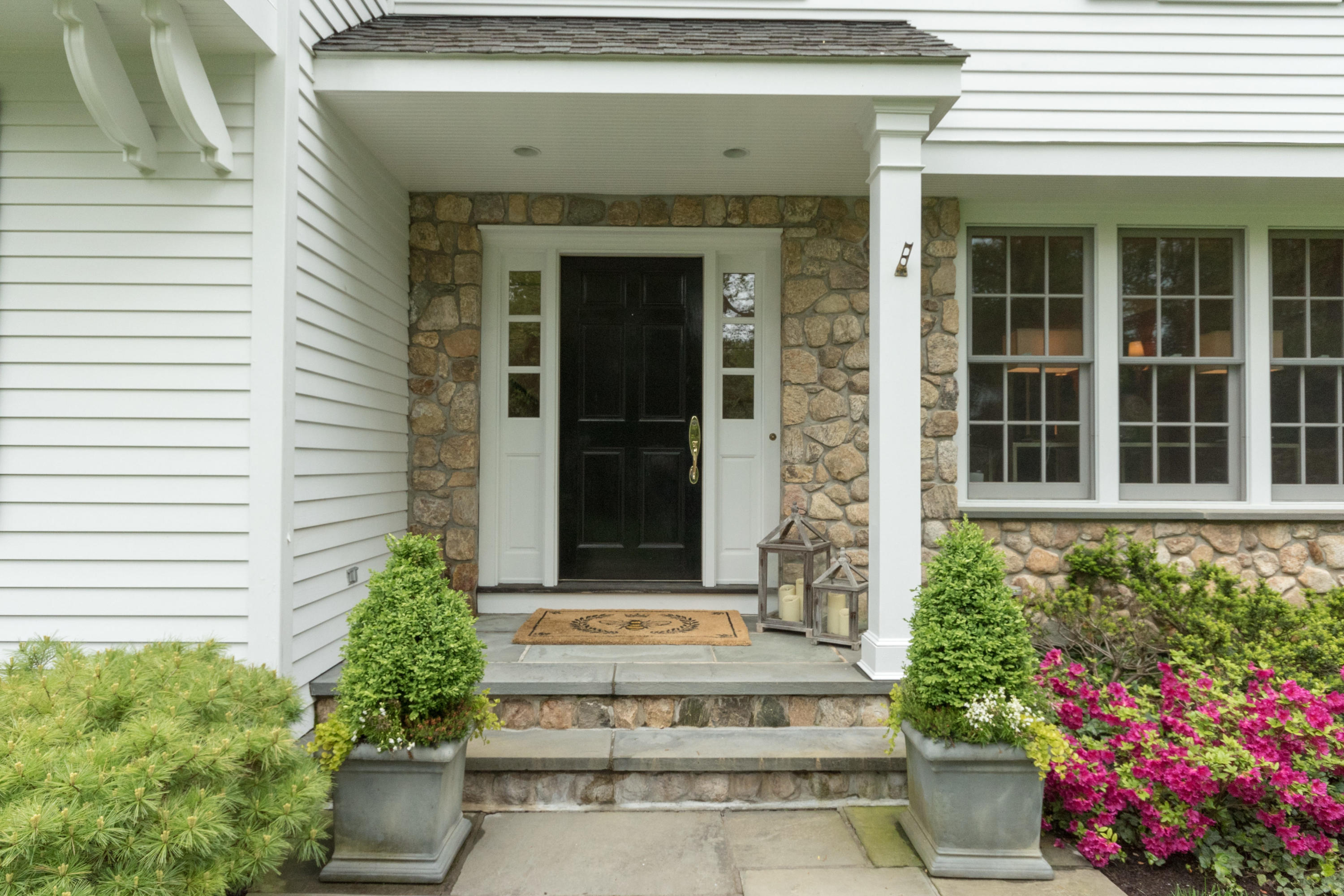 280 Hollow Tree Ridge Road Darien, CT 06820 - Photo 5 of 66 a front view of a house with a garden