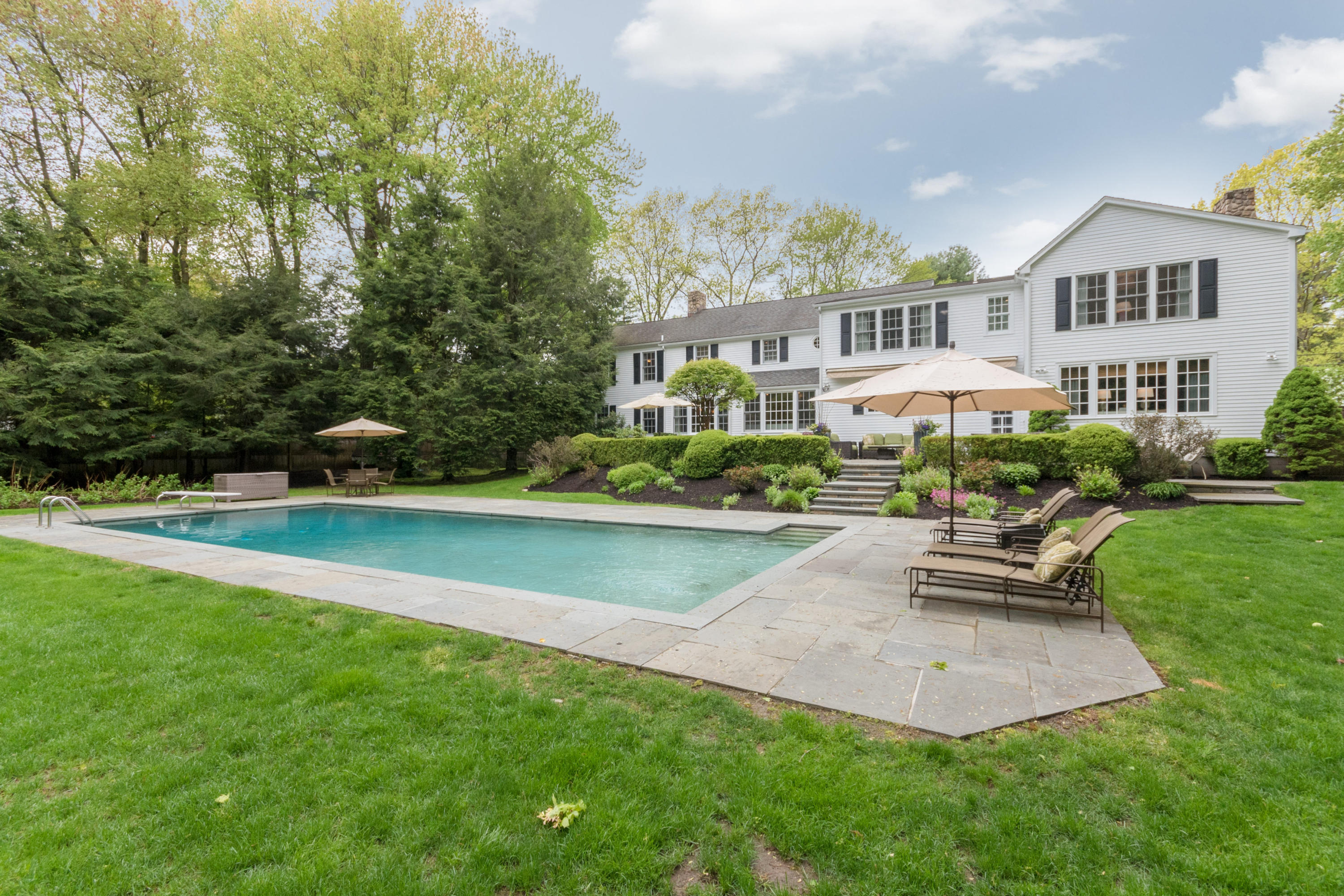280 Hollow Tree Ridge Road Darien, CT 06820 - Photo 59 of 66 a view of a house with a yard patio and sitting area